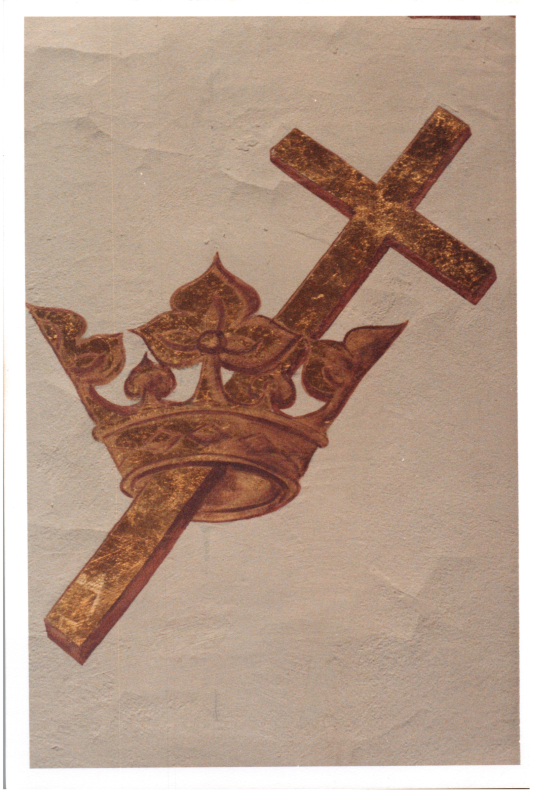 A picture of the gold Cross and Crown emblem in the sanctuary