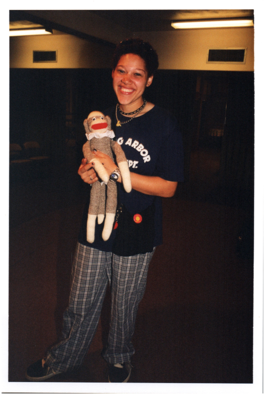 A woman holds a stuffed animal
