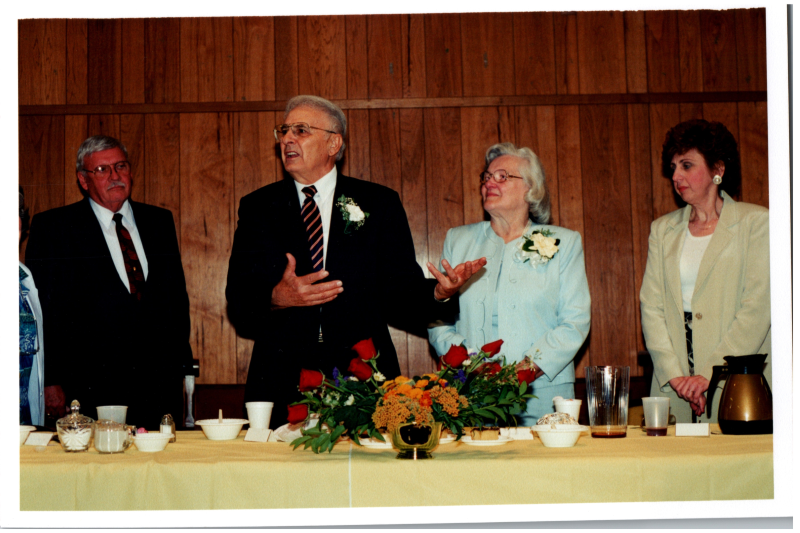 Rev. Bogdan speaks from a front table