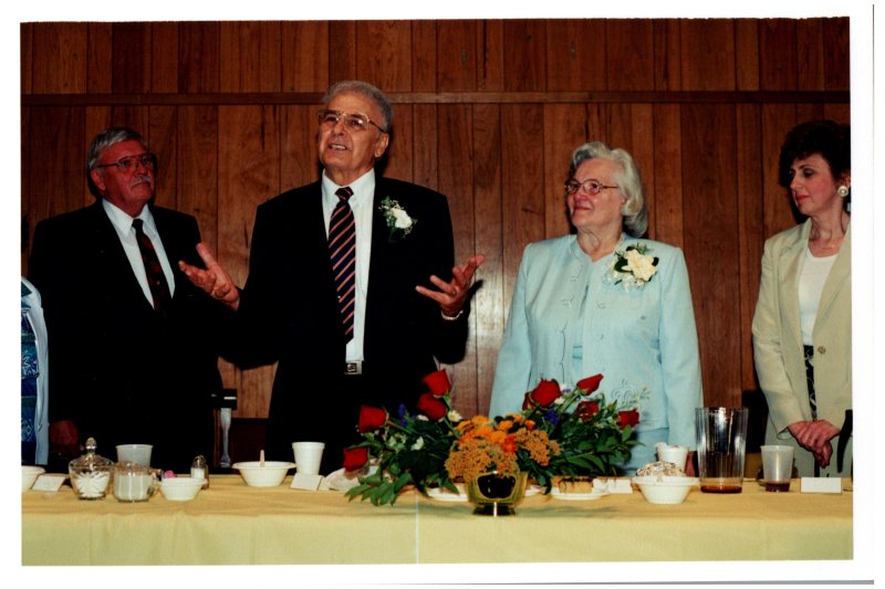 Rev. Bogdan speaks from a front table