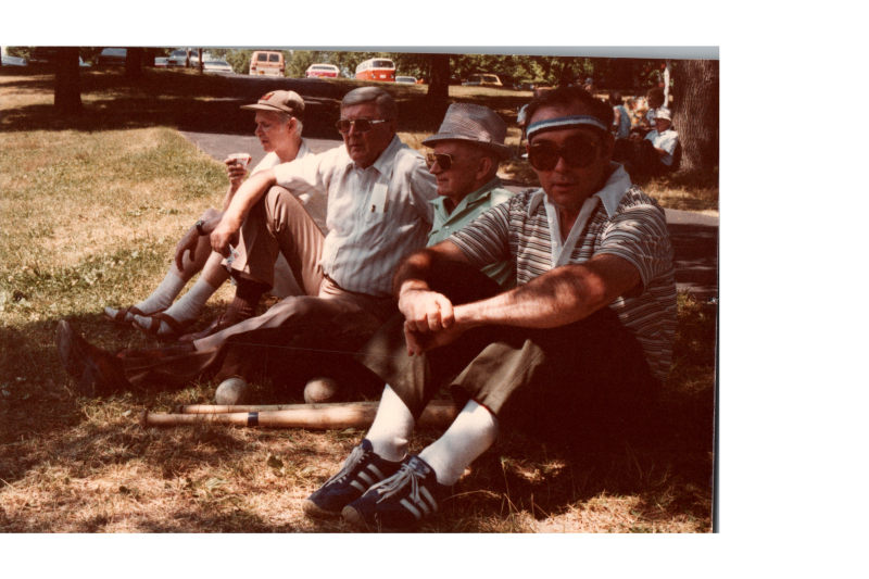Four men sit together