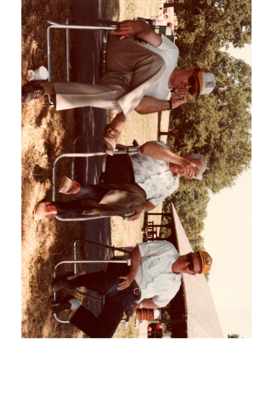 Three men sit together
