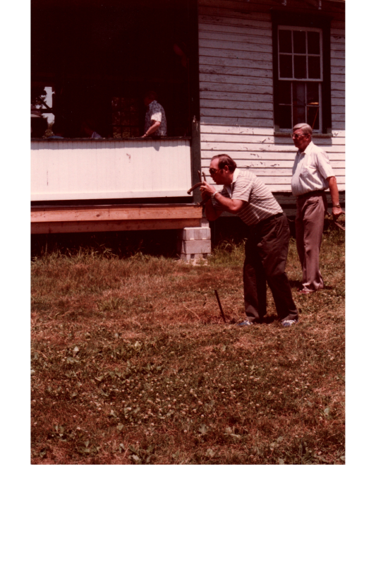 A man throws a horseshoe