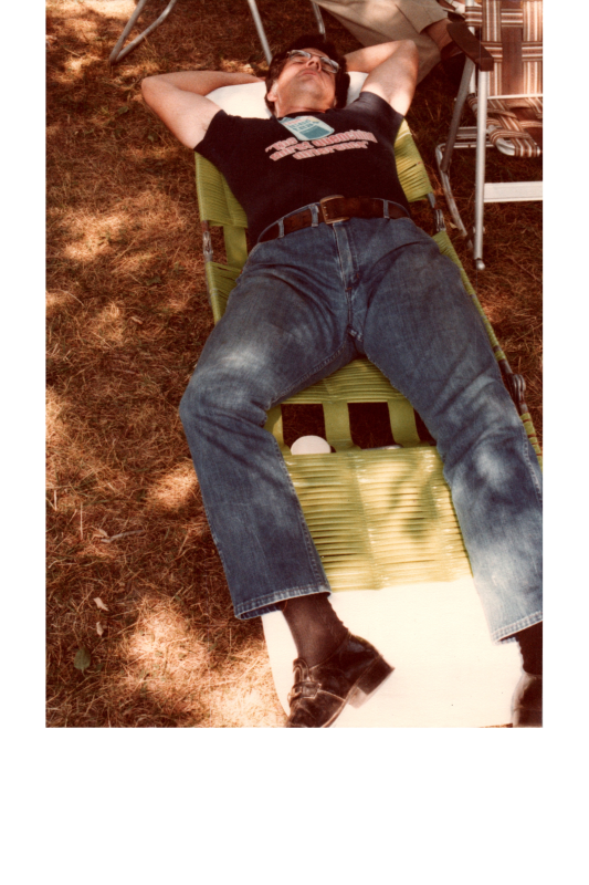 A man naps in a lawn chair