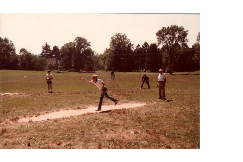 A man pitches a ball
