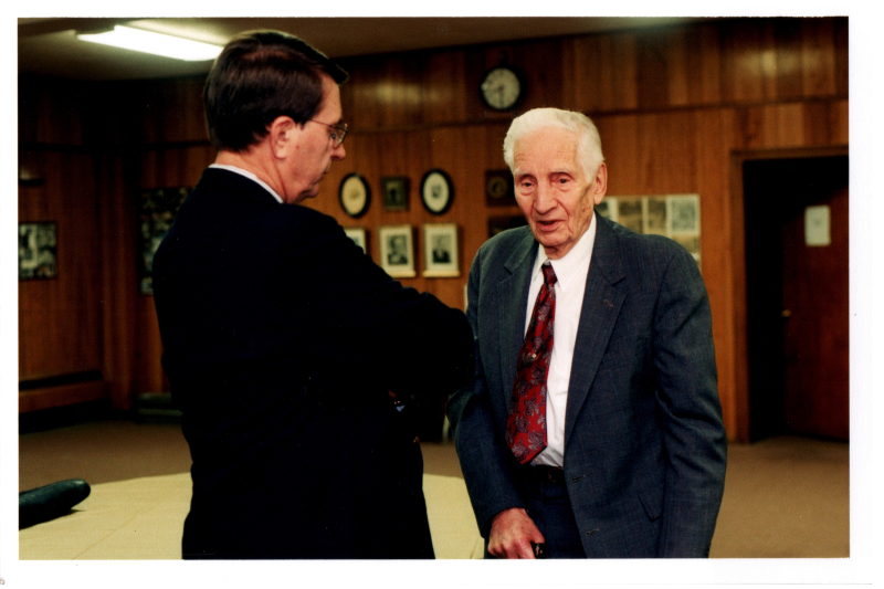 Pastor Wegner speaks with a man