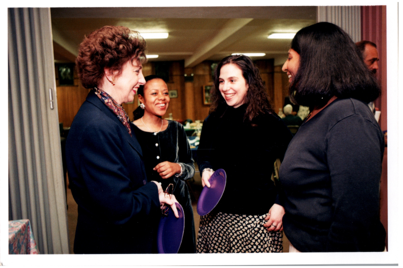 Mrs. Wegner talks with Mrs. Bustos and two other women