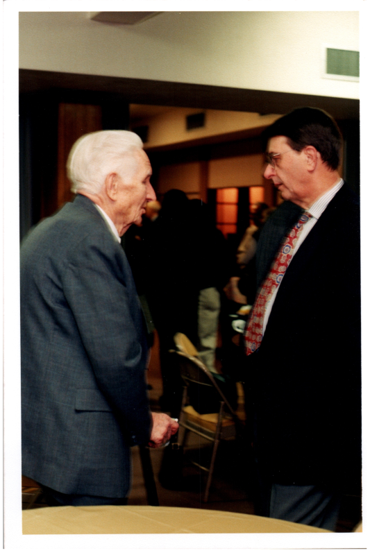 Pastor Wegner speaks with a man
