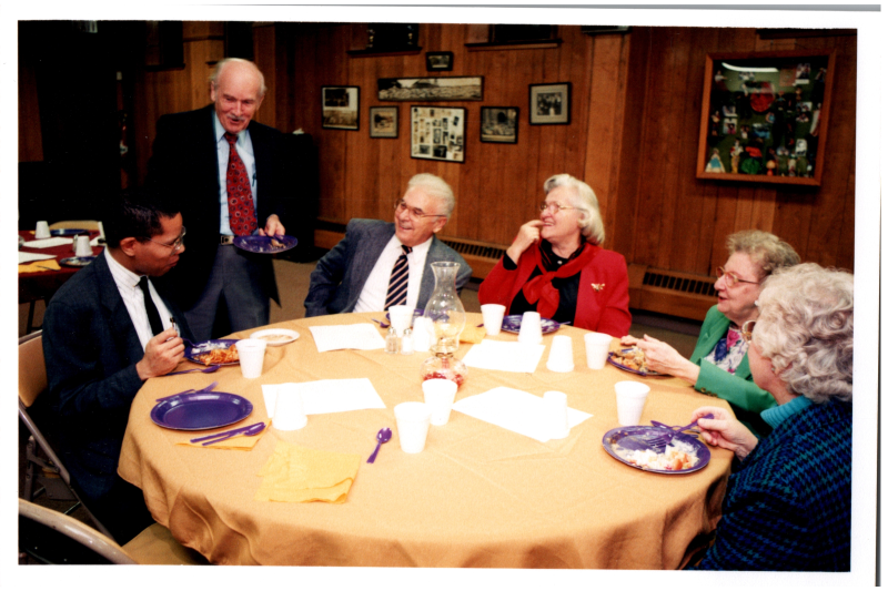 Congregants, including Otis A. Fortenberry and the Bogdans, dine together