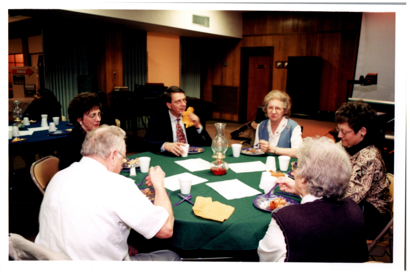 Congregants, including the Wegners and Betty Roberson, dine together