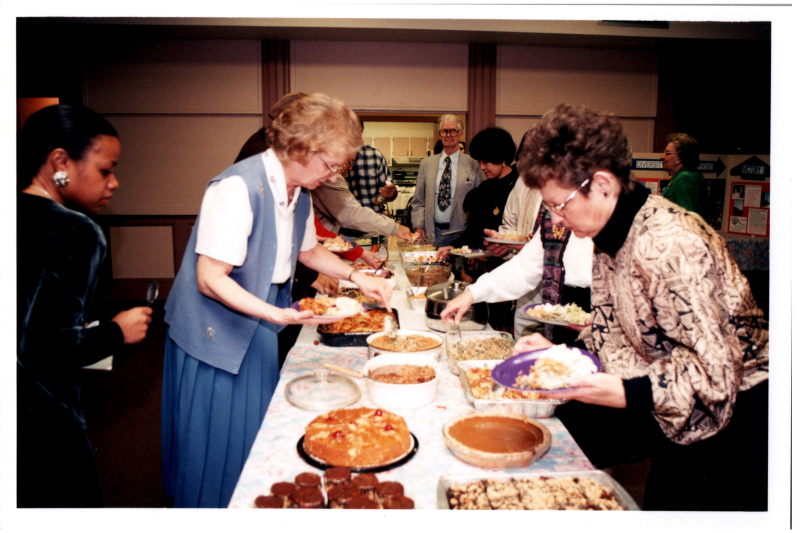 Congregants serve themselves from a buffet