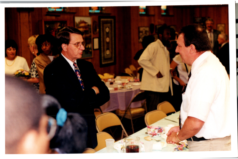 Pastor Wegner speaks with a man