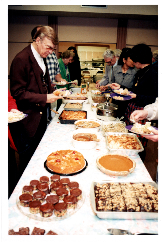 Congregants serve themselves from a buffet