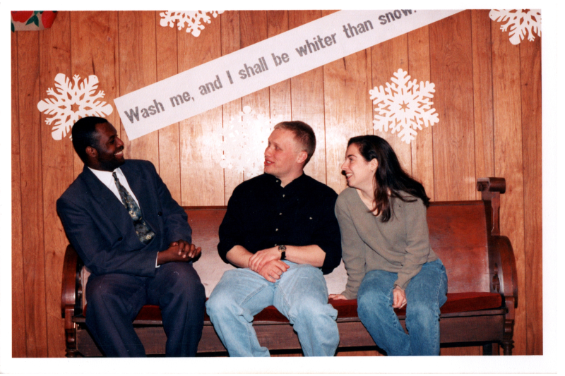 A group, including Mike Wulin, speak with each other