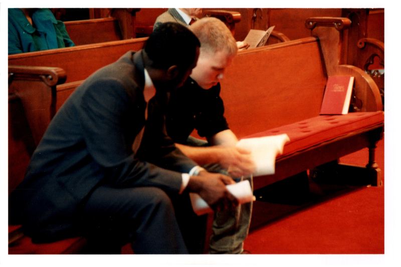 Mike Wulin and a man read together