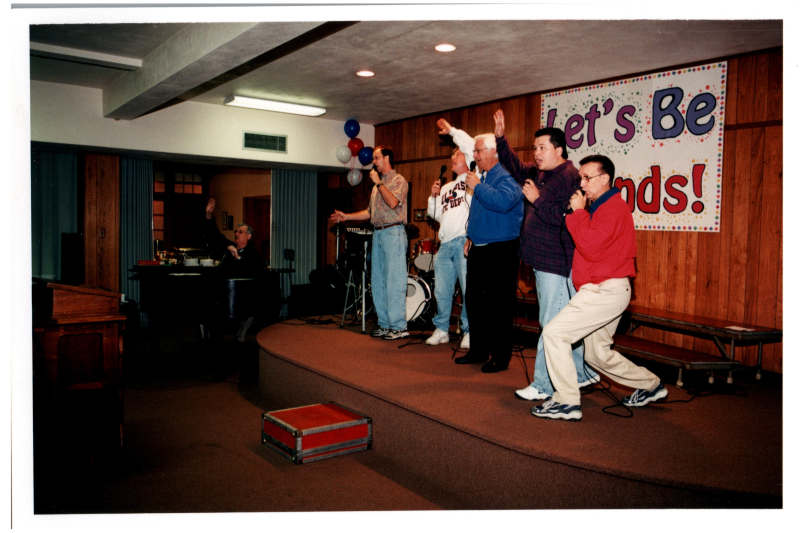 A group of men sing