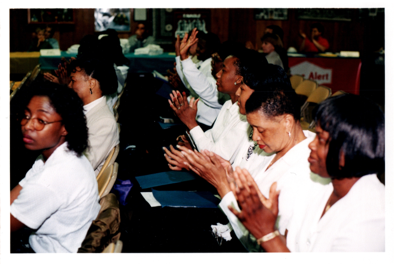 Congregants clap along to a song
