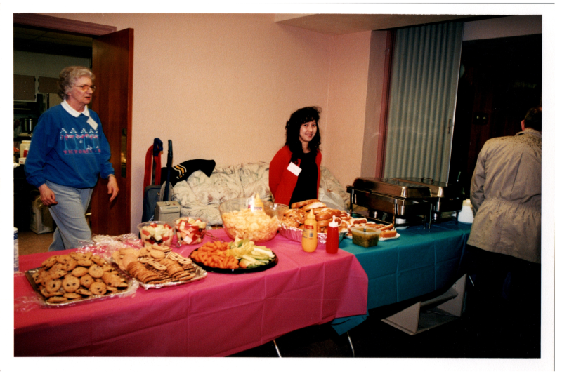 Ginny Vega and Betty Roberson serve food