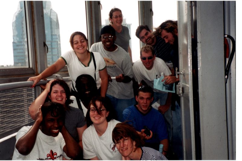 A group smiles in a Philadelphia skyscraper