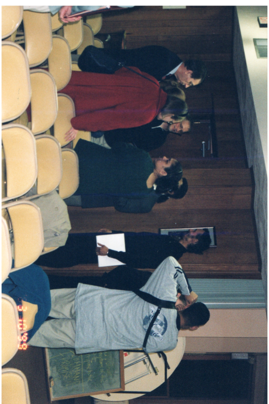 A group congregates and speaks