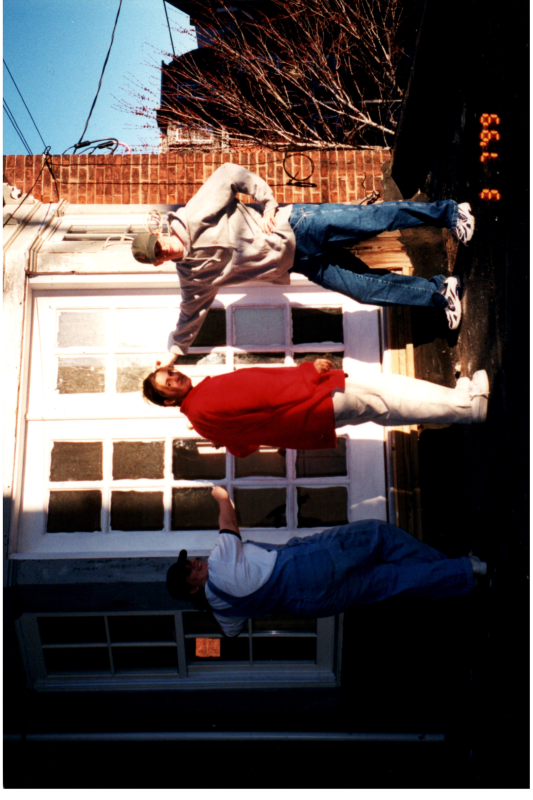A team paints the parsonnage exterior