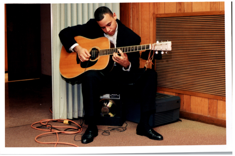 Man plays guitar