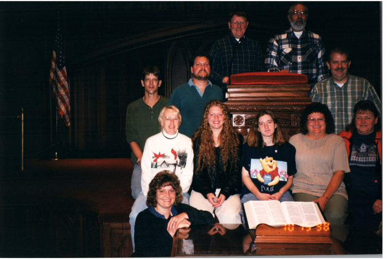 A group smiles together in Highway's sanctuary