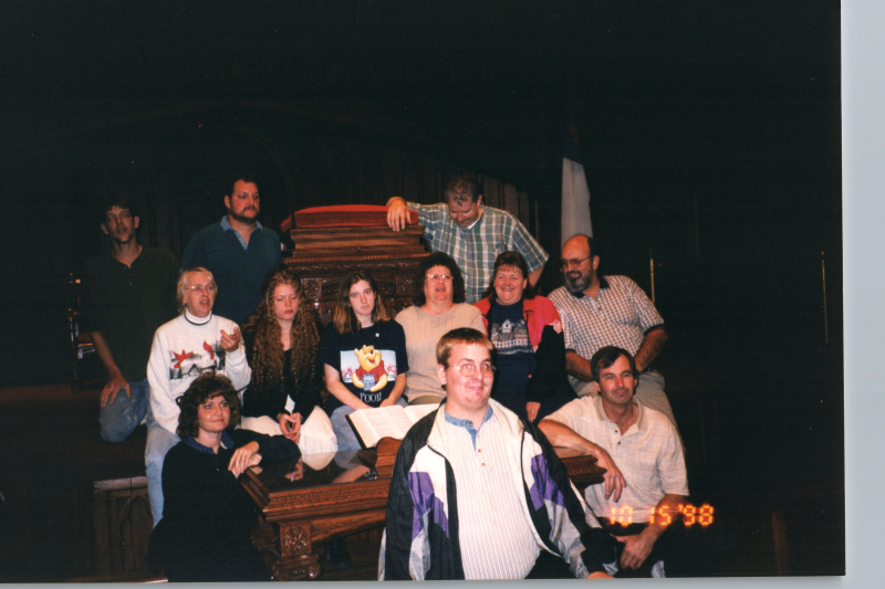 A group smiles together in Highway's sanctuary