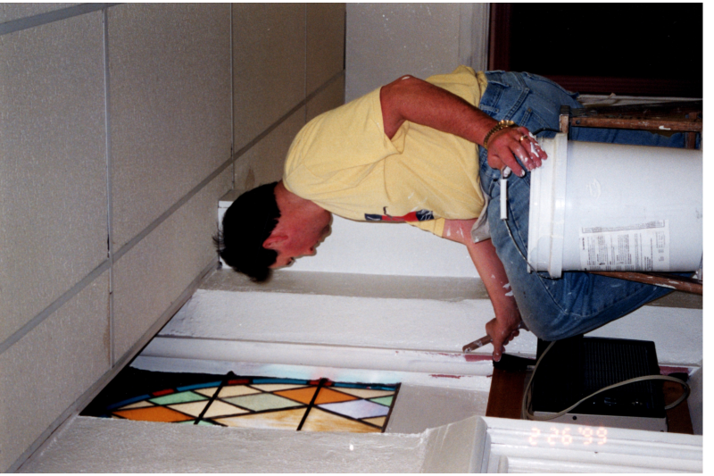 Man installs a window-unit air conditoner