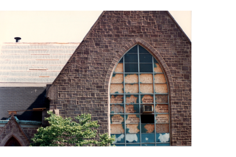 Boarded up roof and windows