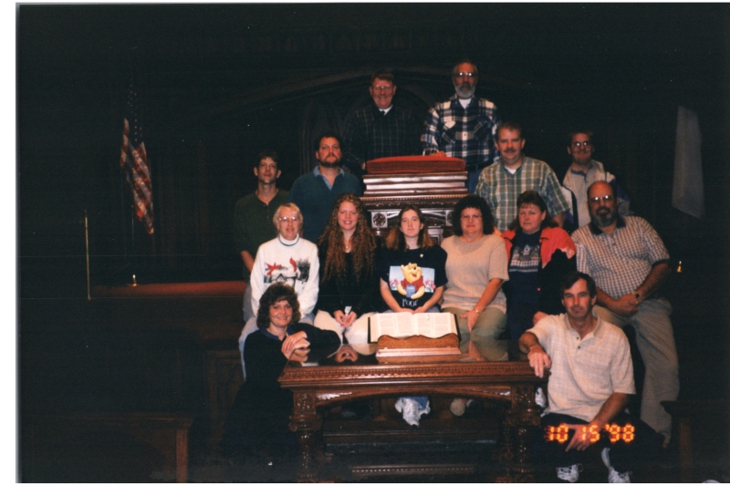 A group smiles together in Highway's sanctuary