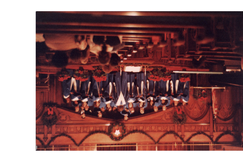 Adults and children sing together as a choir