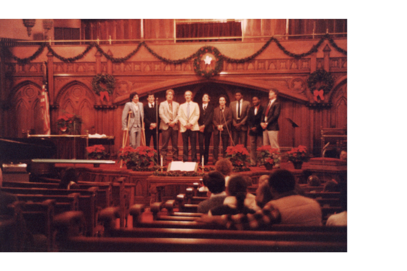 A group of men sing together