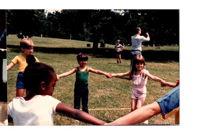 Children hold hands in a circle