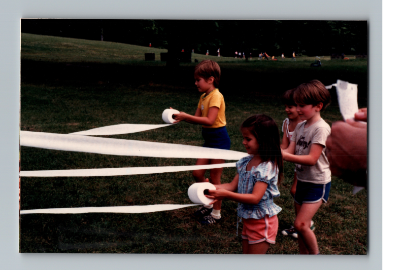 Children play with toilet paper