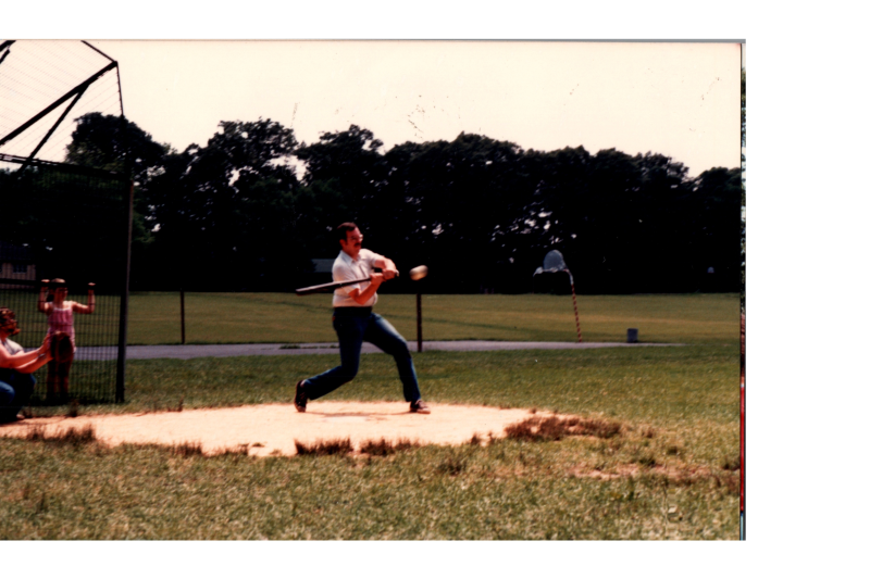 A man swings a baseball bat
