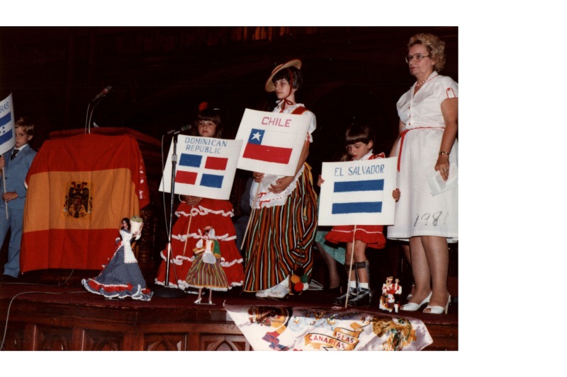 Children dess up and carry flags from different South American countries
