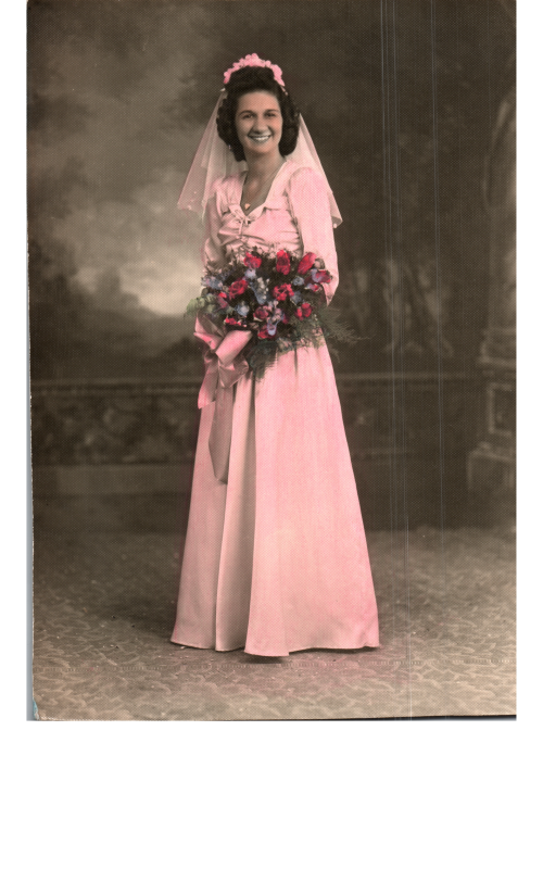 A bride is photographed with a bouquet