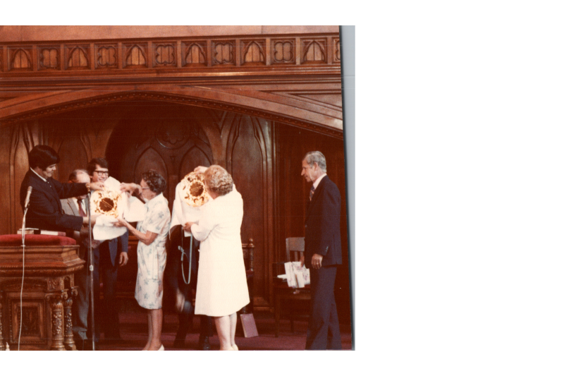 Members of the church are presented decorative plates