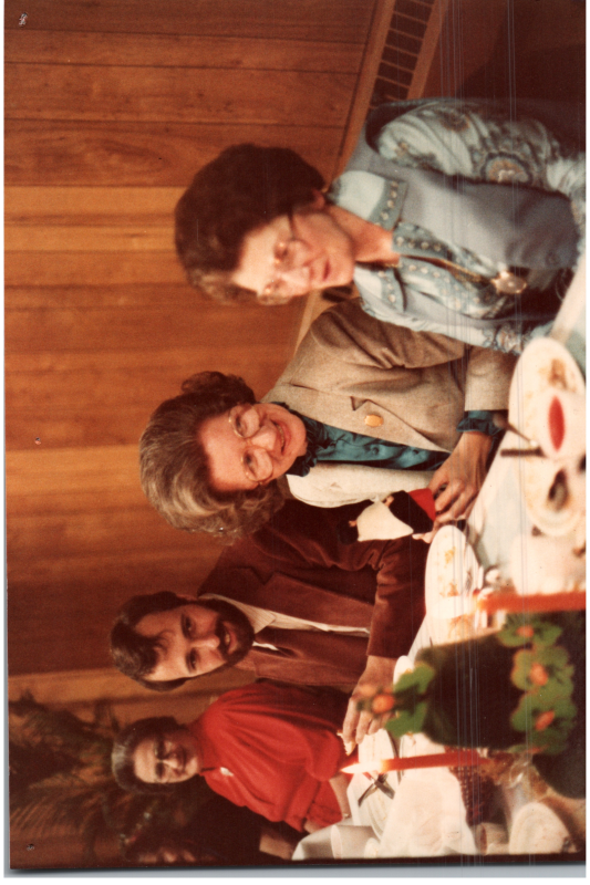 Betty Roberson and others eat at tables decorated with international decor