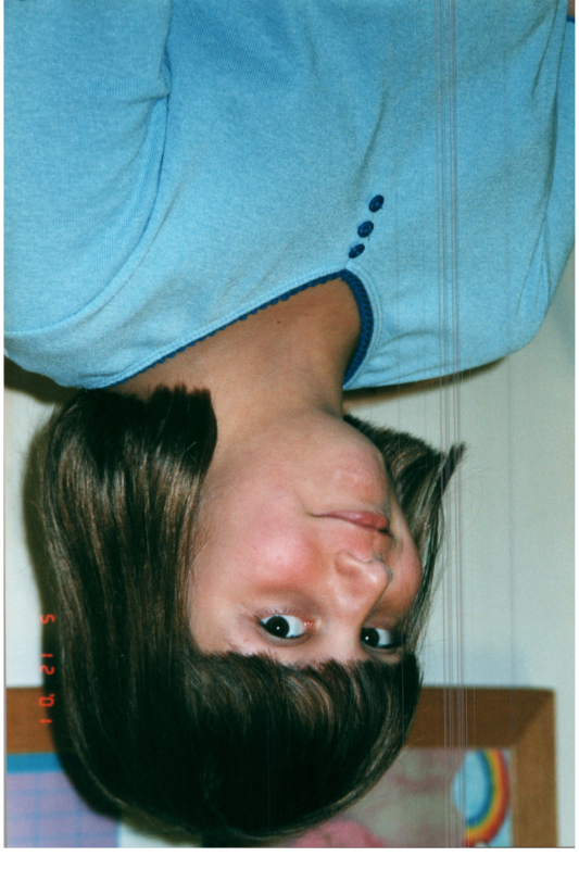 A girl smiles for a photograph