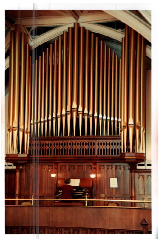 A woman plays the organ in Highway's sanctuary