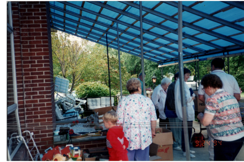 Residents walk around an outdoor space