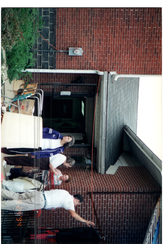 Residents walk around an outdoor space
