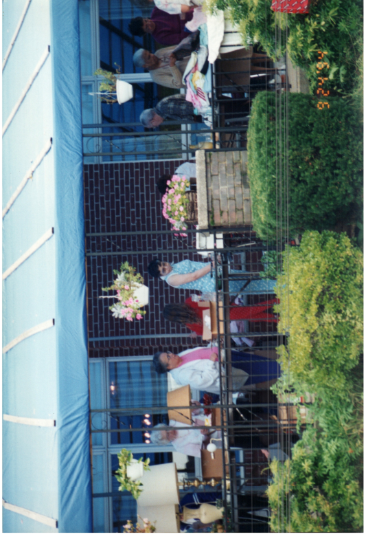 Residents walk around an outdoor space