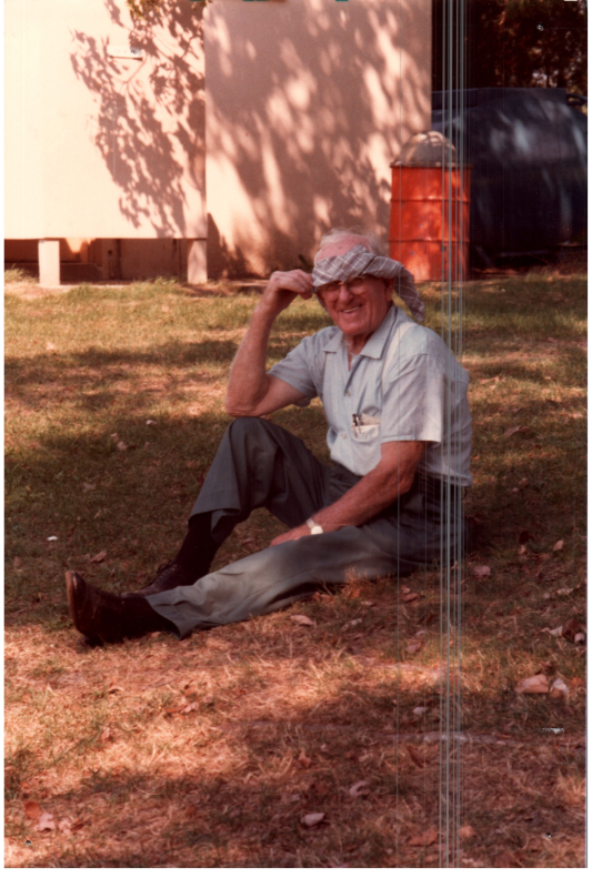 A man sits on a field