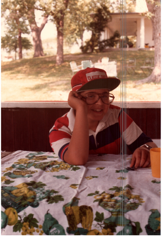 A boy smiles for a photograph