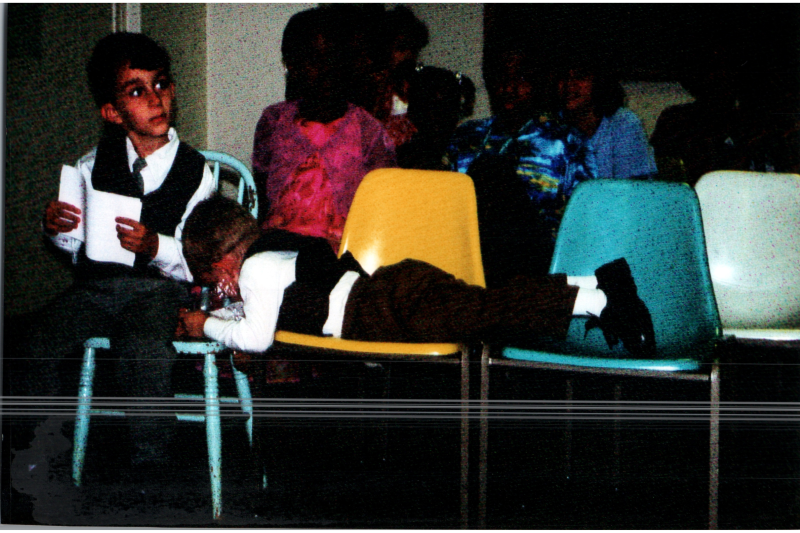 A group of children sit together