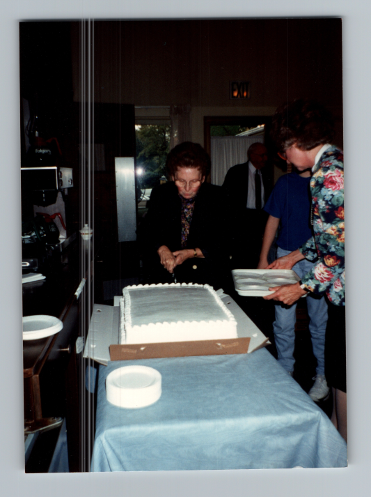 Betty Roberson and another woman set out a cake