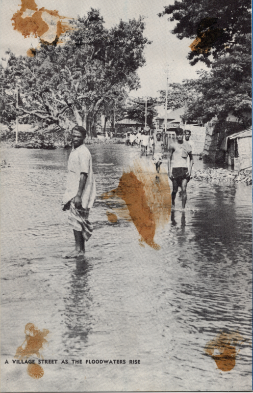A picture captioned, "A Village as the Floodwaters Rise"